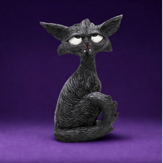 Black cat humorous figurine with white eyes looking up and little white fangs  on a purple background