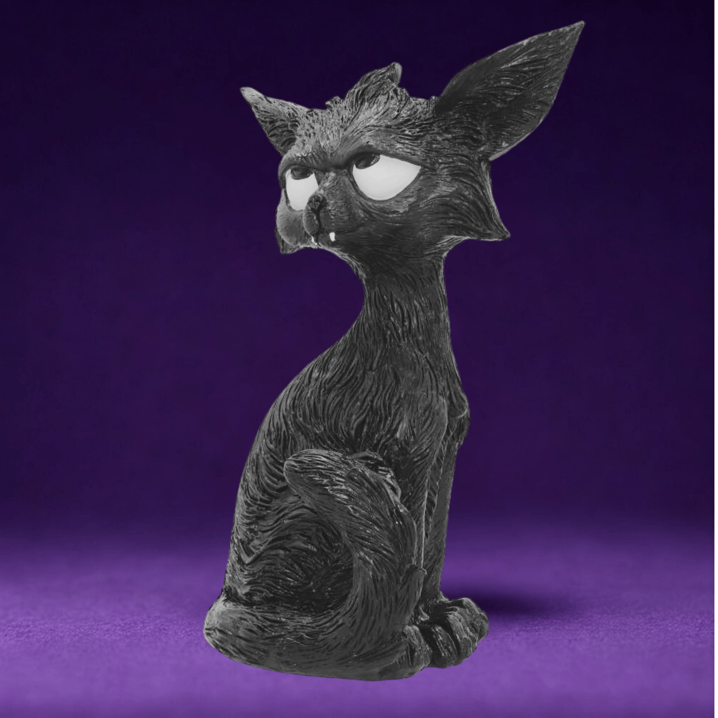 Black cat humorous figurine with white eyes looking up and large ears and little white fangs on a purple background 