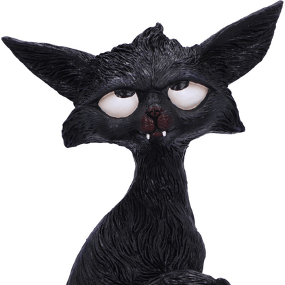 Black cat humorous figurine with white eyes looking up and large ears and little white fangs on a white background