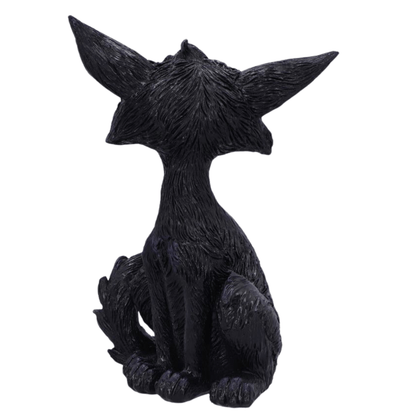 Back of the black cat figurine with large ears on a white background