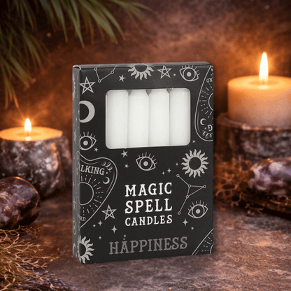 Box of 'Magic Spell Candles Happiness' with candles and mystical elements in the background