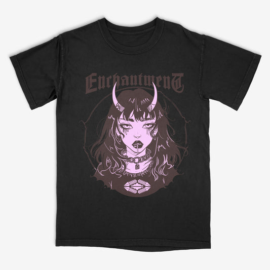 Black T-Shirt with a graphic of a gothic anime girl with horns and the text Enchantment across the chest laying on a white background