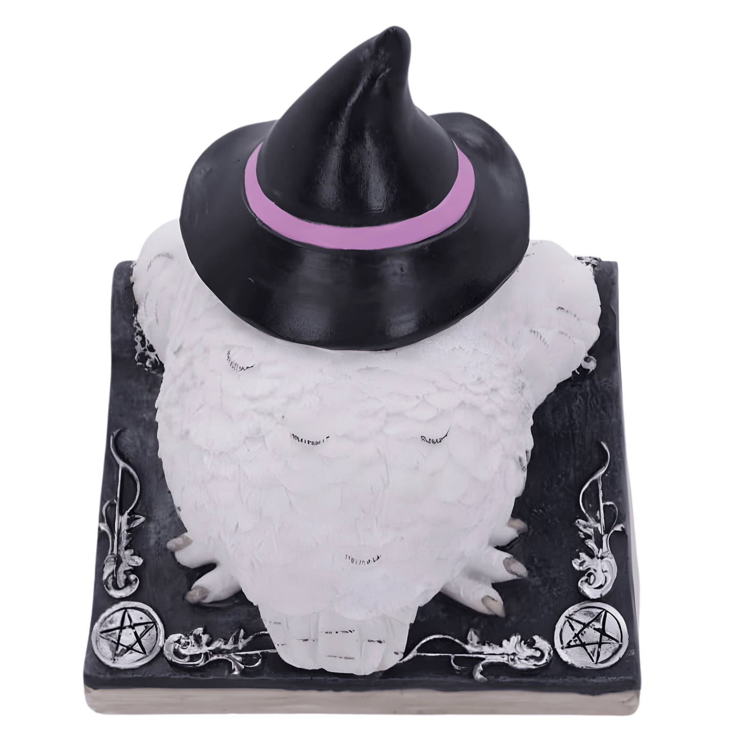 Back of a white owl figurine wearing a black witch hat with a pink band on a black base with white designs.