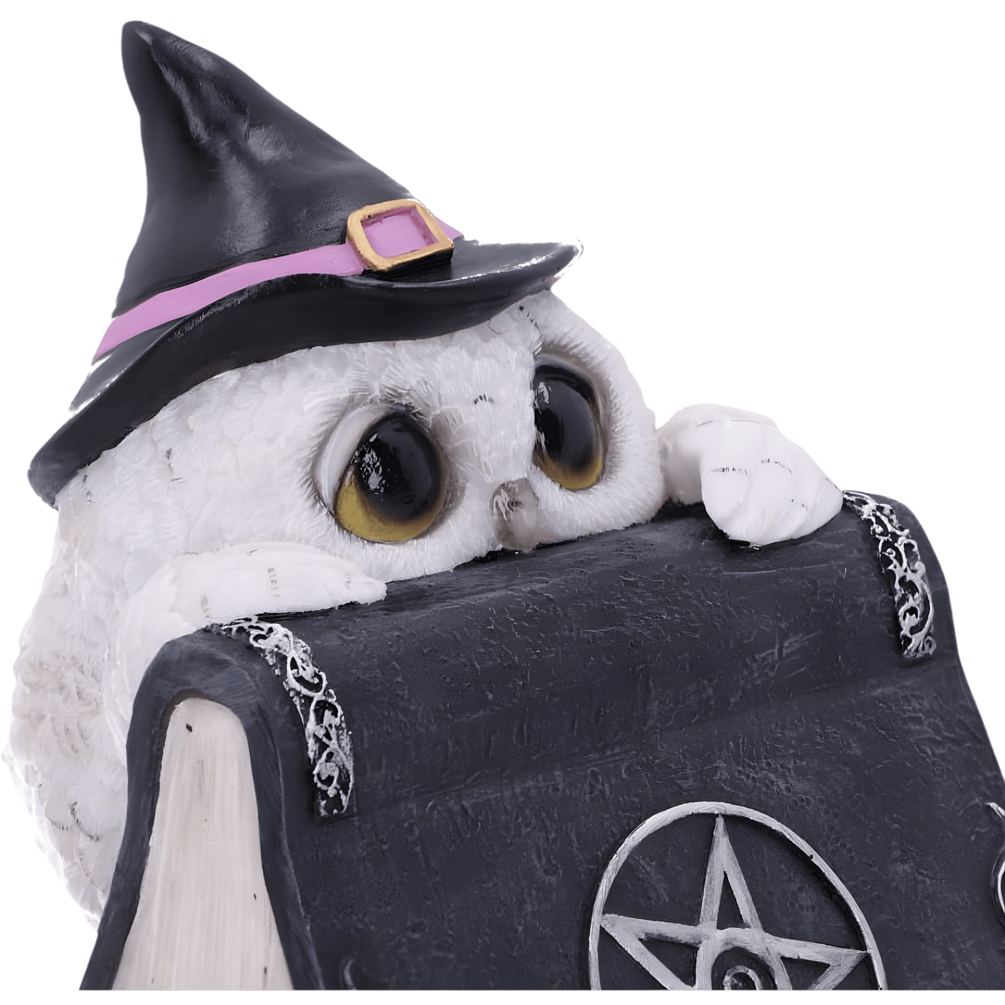White owl figurine wearing a witch hat with a pentagram symbol on a black background
