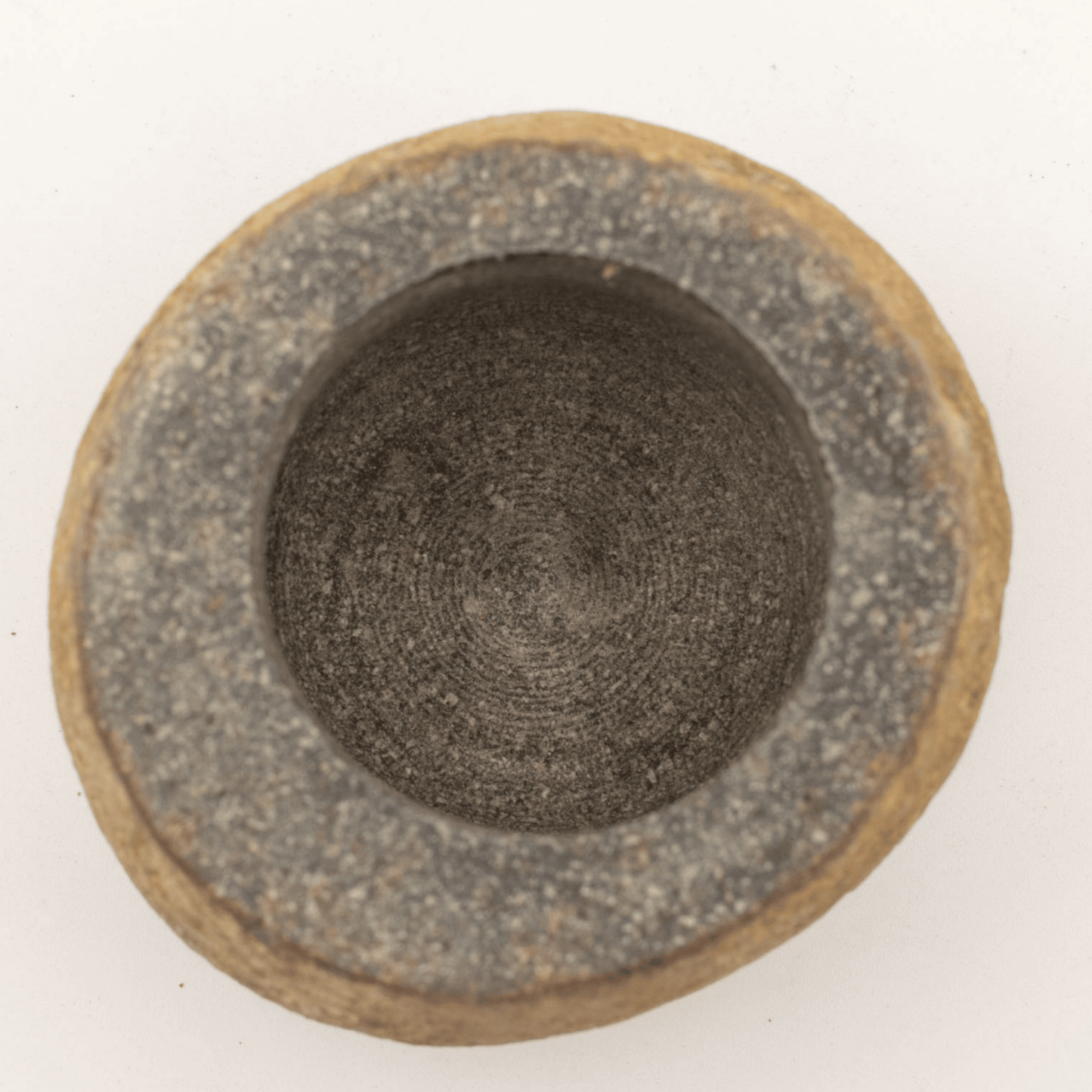 Ceramic bowl with textured surface on a white background