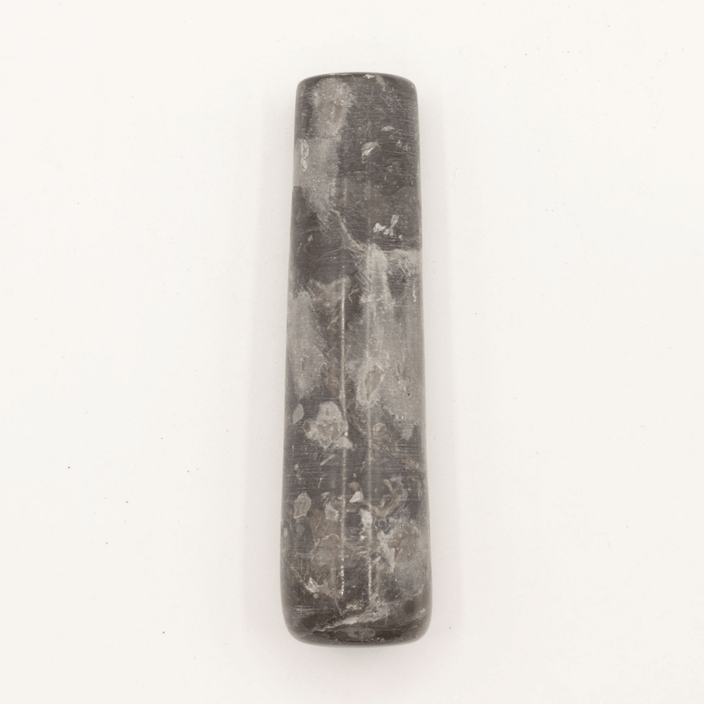 Black stone tool on a white background