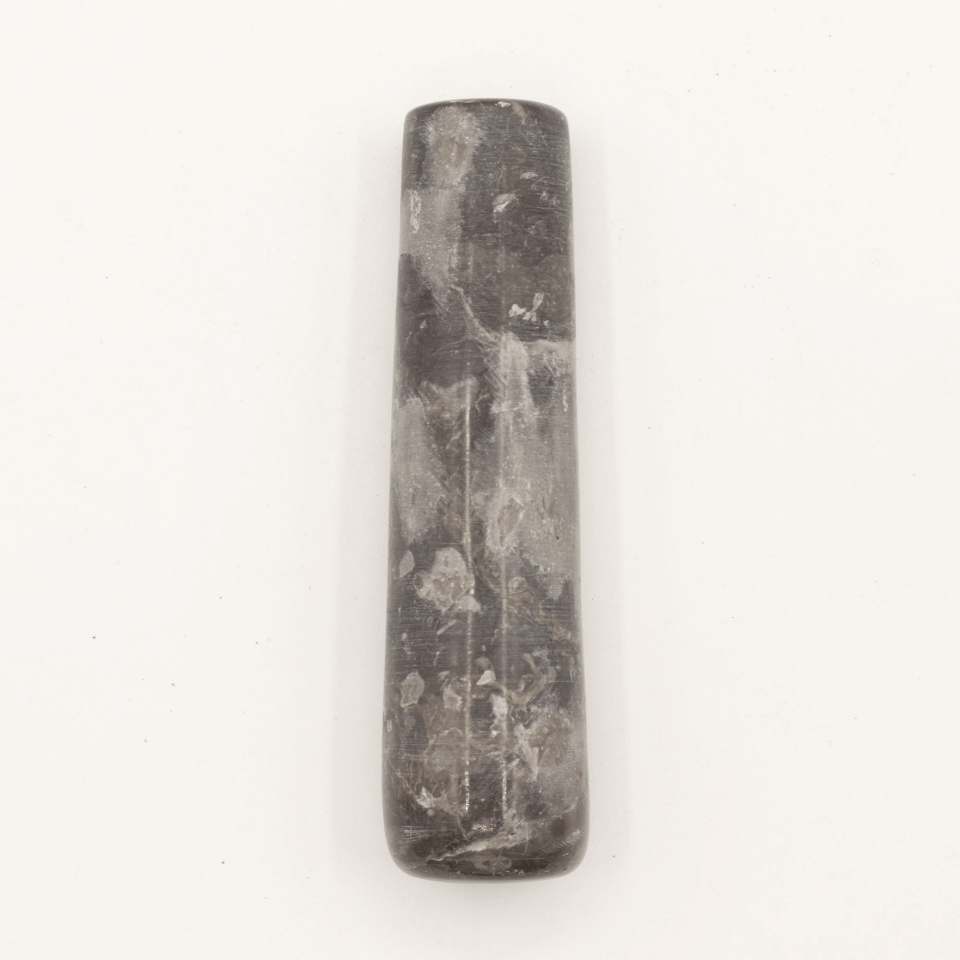Black stone tool on a white background