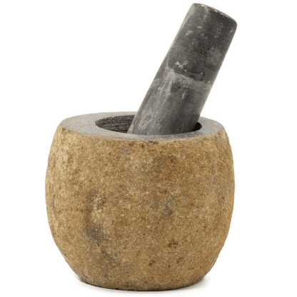 Stone mortar and pestle on a white background