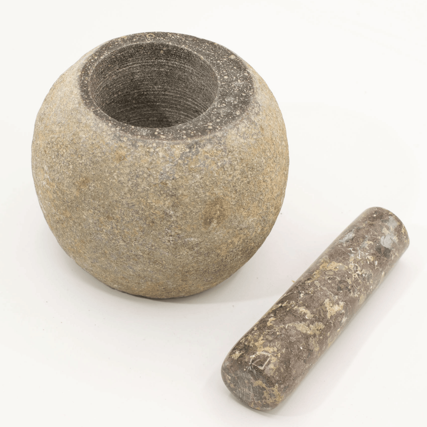 Stone mortar and pestle on a white background