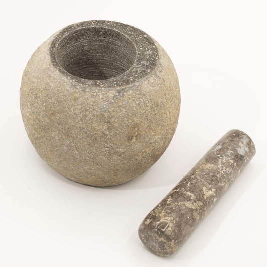 Stone mortar and pestle on a white background