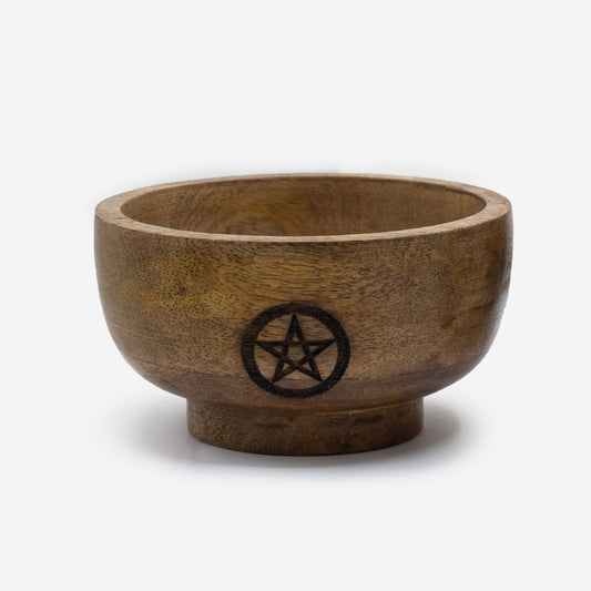 Wooden bowl with a pentagram symbol on a white background