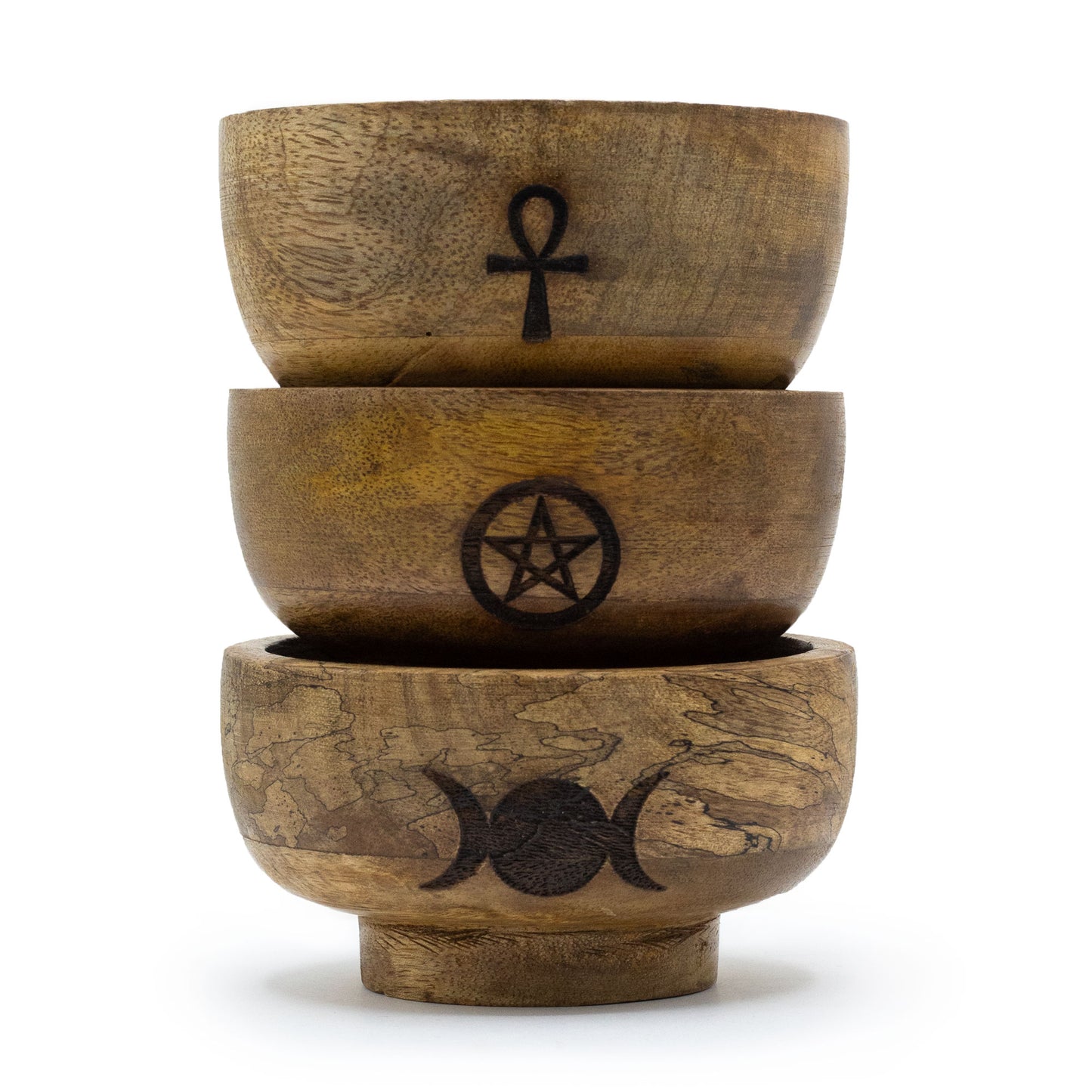 Three wooden bowls stacked on top of each other with symbols engraved on a white background