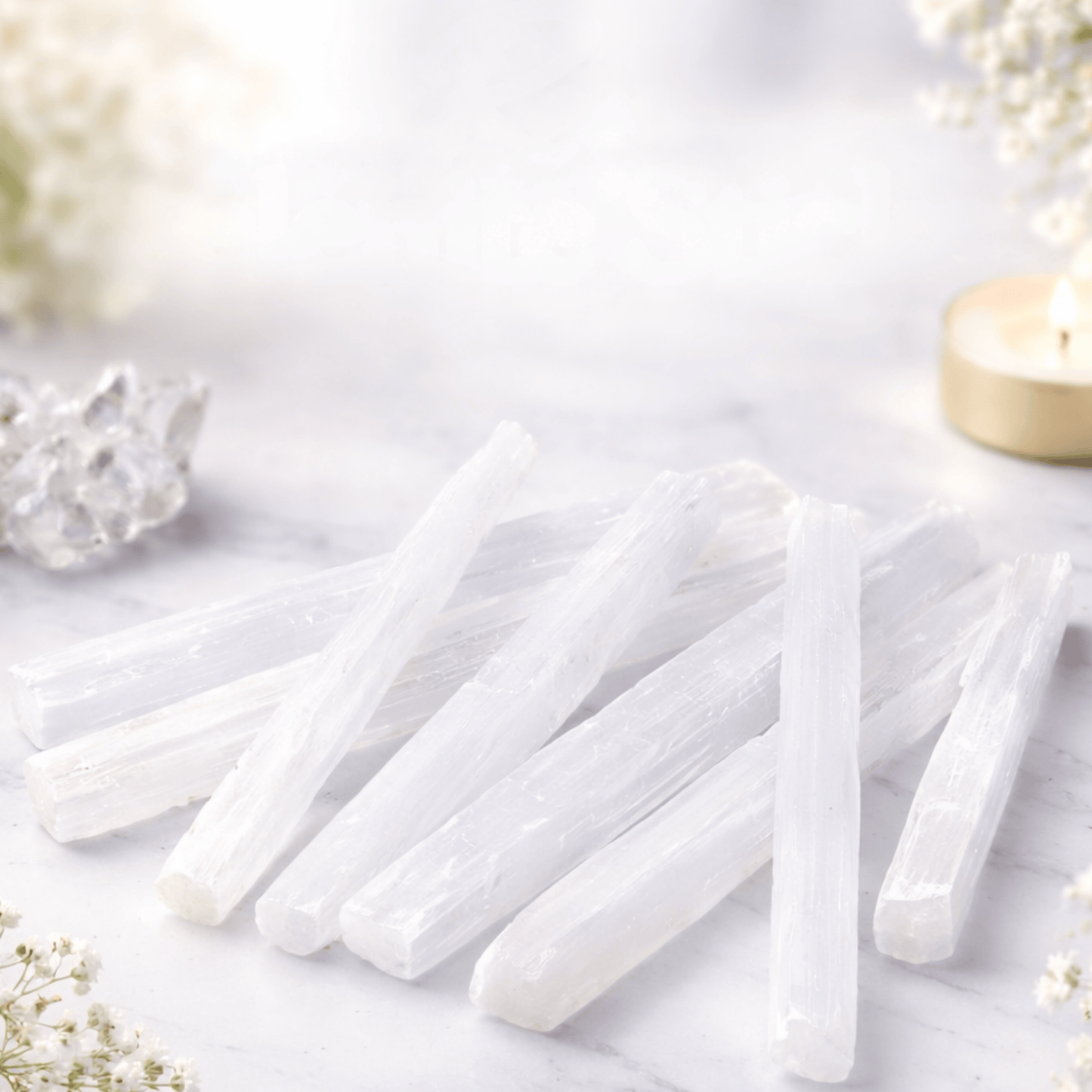 Selenite sticks 16-20cm on a white background