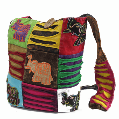 Colorful patchwork bag with elephant designs on a white background