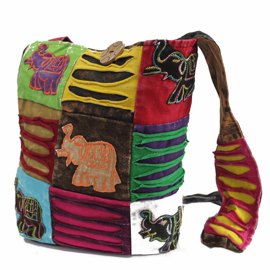 Colorful patchwork bag with elephant designs on a white background