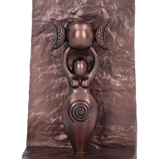 Bronze sculpture of a Goddess holding a triple moon with spiral design on a textured bronze background