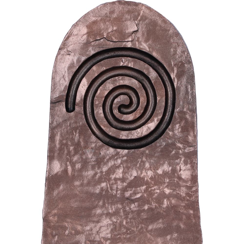 Close up of the Spiral design on the bronze holder on a textured surface