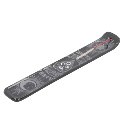 Long, narrow incense holder with spirit board on it on a white background