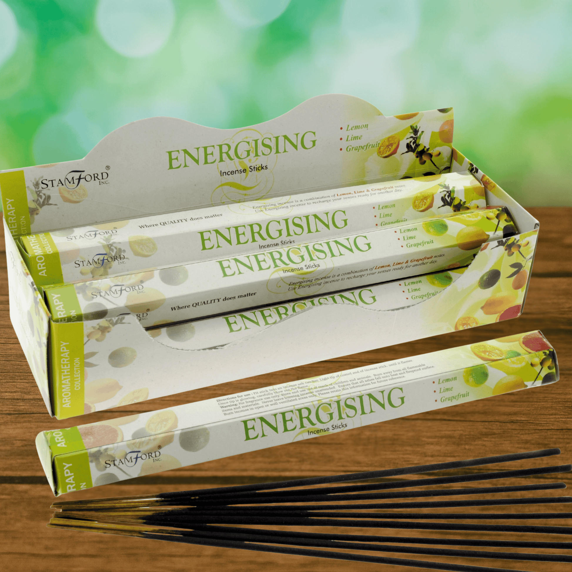 Stamford Energising incense sticks packaging on a wooden surface with a green blurred background