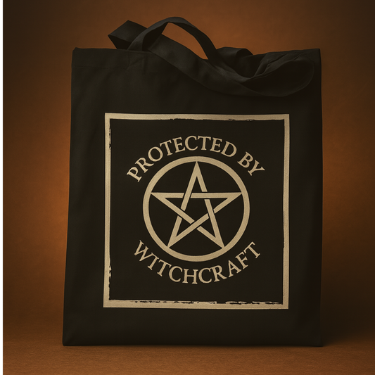 Black tote bag with 'Protected by Witchcraft' design on a gold background