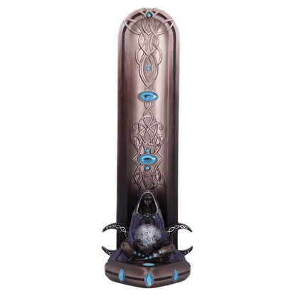Decorative incense burner with intricate designs and blue accents on a white background