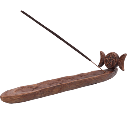 Wooden incense burner with incense stick on a white background