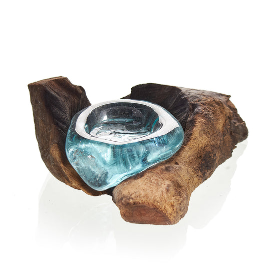 Blue glass candle holder on a wooden base with a white background