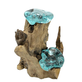 Decorative piece with blue glass elements on a wooden base