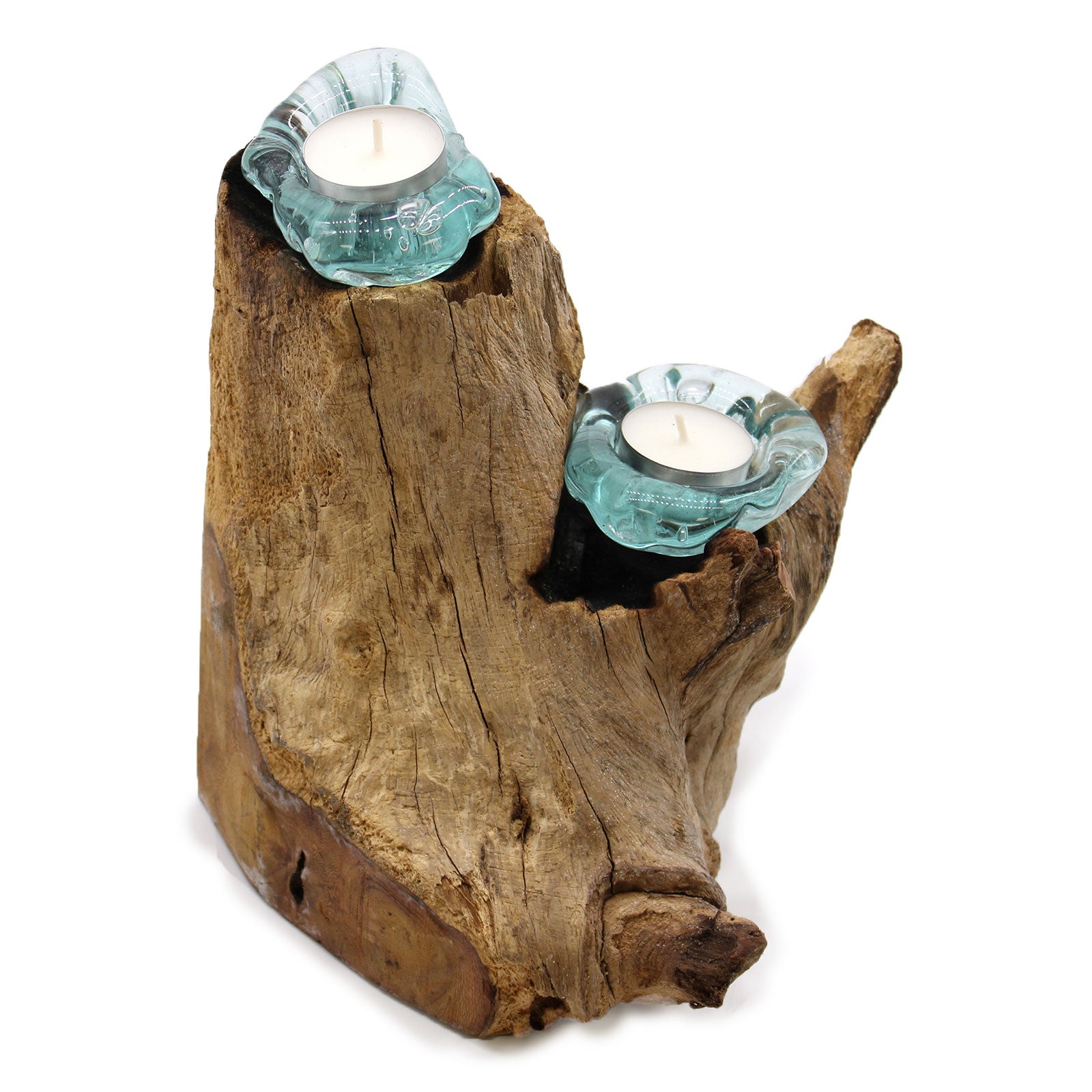 Driftwood candle holder with two teal glass candle holders and white candles on a white background